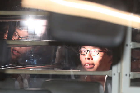 Student leader Joshua Wong leaves the High Court in a prison van after his sentencing on charges related to the 2014 pro-democracy Umbrella Movement, also known as Occupy Central protests, in Hong Kong, China August 17, 2017. Picture taken through tinted glass. Apple Daily/Tse Wing Yiu via REUTERS