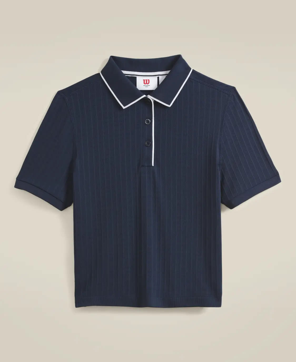Navy blue polo with white trim at collar.