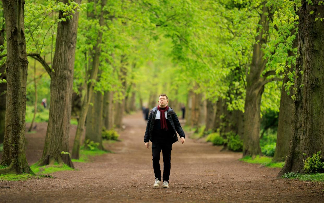 Jack Rear passes through the woods near Kenwood House as he begins his slow commute to the Telegraph office from his home in Highgate