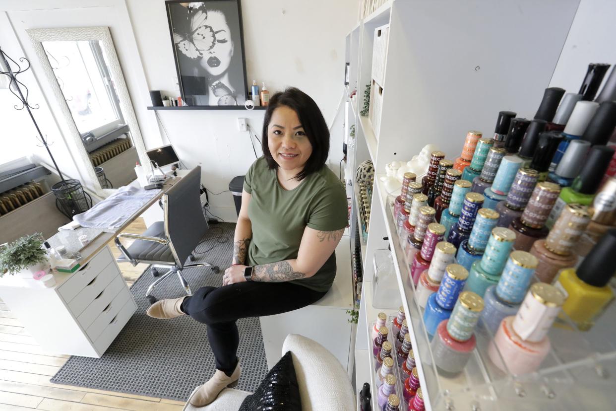 Linda Chang sits in her nail studio, Finishing Touch Nails, March 15, 2022, at 319 Market St. in Oshkosh, Wis. Chang made the decision to start her own business two years ago and hopes to continue growing it.