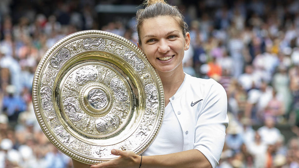 Simona Halep with the trophy after winning the Wimbledon final. (Photo by Tim Clayton/Corbis via Getty Images)