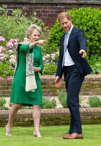 <p>Dominic Lipinski - WPA Pool/Getty</p> Julia Samuel and Prince Harry at the unveiling of the statue of Princess Diana in the Sunken Garden at Kensington Palace on July 1, 2021.