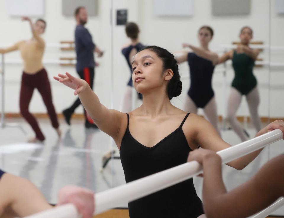 Wendy Moreno-Garcia takes ballet class at Nan Klinger Excellence in Dance in Cuyahoga Falls on Thursday.