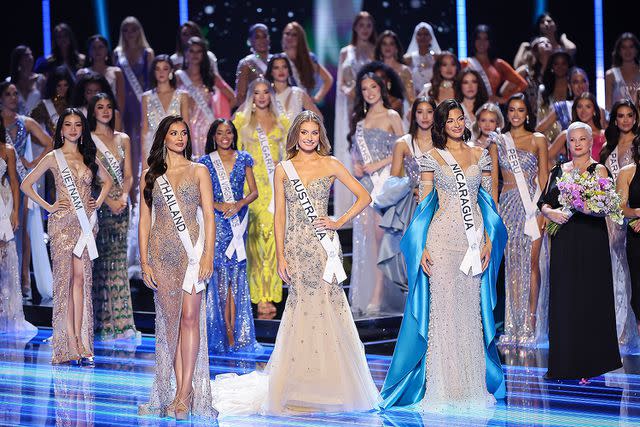 <p>Hector Vivas/Getty </p> Miss Thailand Anntonia Porsild, Miss Australia Moraya Wilson and Miss Nicaragua Sheynnis Palacios line up during the 72nd Miss Universe Competition on Saturday