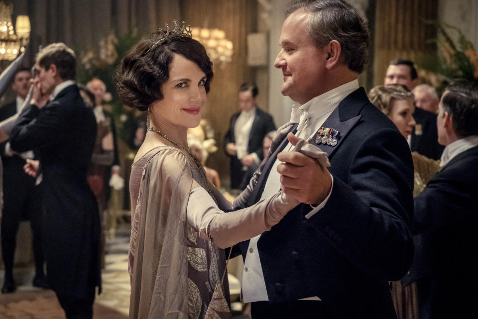 This image released by Focus Features shows Elizabeth McGovern, left, as Lady Grantham and Hugh Bonneville, as Lord Grantham, in "Downton Abbey". The highly-anticipated film continuation of the “Masterpiece” series that wowed audiences for six seasons, will be released Sept. 13, 2019, in the United Kingdom and on Sept. 20 in the United States. (Jaap Buitendijk/Focus Features via AP)