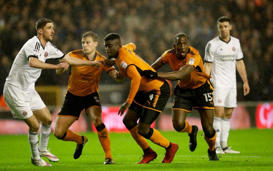 Alfred N'Diaye and Willy Boly contest a corner - Getty Images Europe