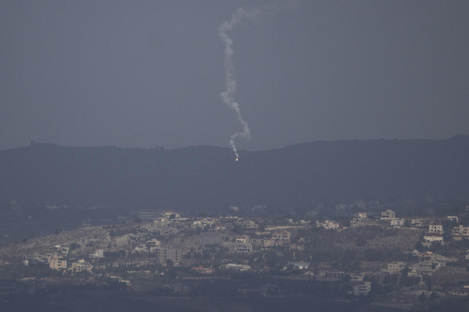 An Israeli army flare is seen over the Israeli-Lebanese border as seen from the Israeli-annexed Golan Heights, Monday, Sept. 16, 2024. (AP Photo/Leo Correa)