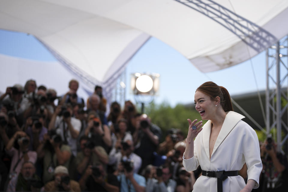 Emma Stone oses for photographers at the photo call for the film 'Kinds of Kindness' at the 77th international film festival, Cannes, southern France, Saturday, May 18, 2024. (Photo by Daniel Cole/Invision/AP)