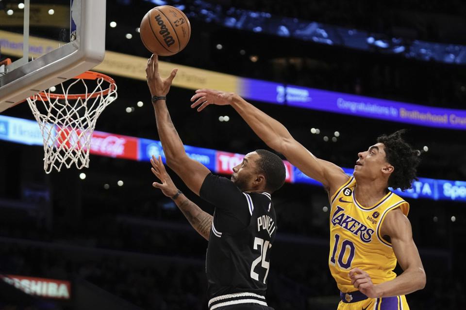 Los Angeles Clippers forward Norman Powell, left shoots as Los Angeles Lakers guard Max Christie defends during the first half of an NBA basketball game Tuesday, Jan. 24, 2023, in Los Angeles. (AP Photo/Mark J. Terrill)