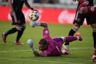 Inter Miami goalkeeper Nick Marsman, center, dives to deflect a shot during the first half of an MLS soccer match against the New York Red Bulls, Friday, Sept. 17, 2021, in Fort Lauderdale, Fla. (AP Photo/Rebecca Blackwell)
