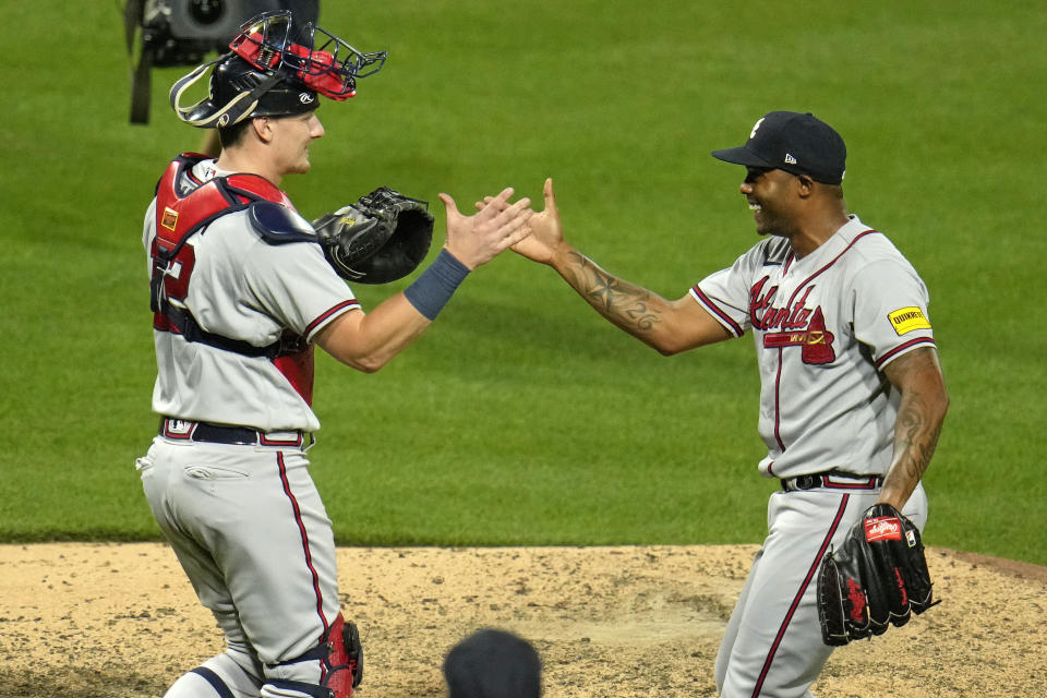 Atlanta Braves relief pitcher Raisel Iglesias, right, celebrates with catcher Sean Murphy after getting the final out of a baseball game against the Pittsburgh Pirates in Pittsburgh, Tuesday, Aug. 8, 2023. The Braves won 8-6. (AP Photo/Gene J. Puskar)