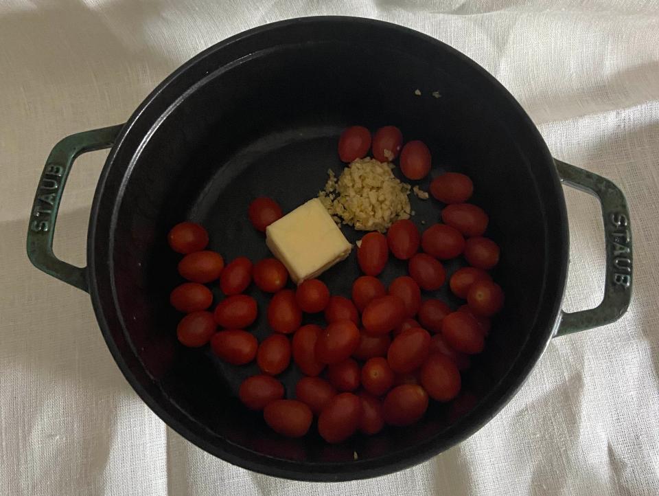 tomatoes, butter, garlic, and yeast in a dutch oven