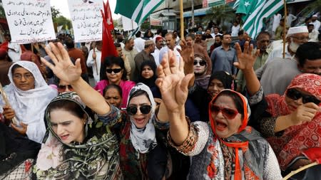 People chant slogans during a rally expressing solidarity with the people of Kashmir, in Karachi