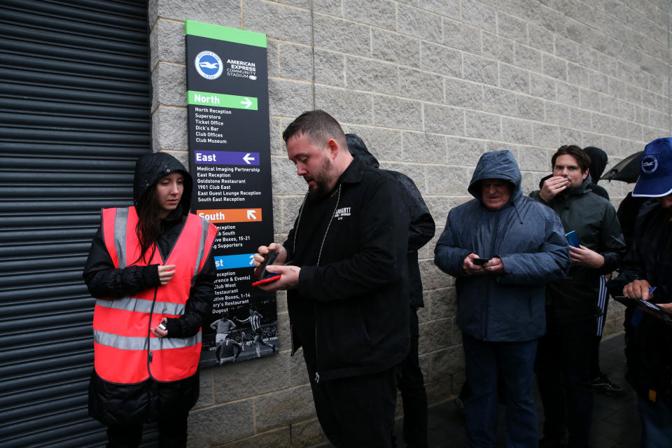 <p>BRIGHTON, ENGLAND - OCTOBER 02: Fans have COVID-19 passes checked by stewards prior to the Premier League match between Brighton & Hove Albion and Arsenal at American Express Community Stadium on October 02, 2021 in Brighton, England. (Photo by Steve Bardens/Getty Images)</p>
