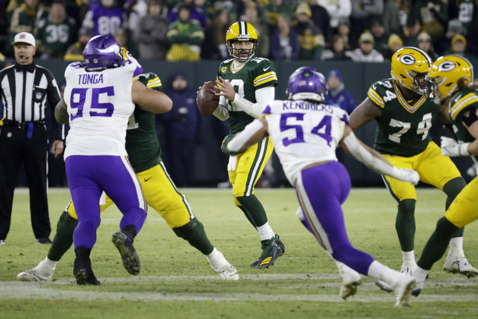 Green Bay Packers quarterback Aaron Rodgers (12) looks to pass during the second half of an NFL football game against the Minnesota Vikings, Sunday, Jan. 1, 2023, in Green Bay, Wis. (AP Photo/Mike Roemer)