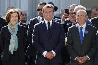 French President Emmanuel Macron, center, French Defense Minister Florence Parly, left, and Eric Trappier, Chairman and CEO of Dassault Aviation, attend the 53rd International Paris Air Show at Le Bourget Airport near Paris, France, Monday June 17, 2019. The world's aviation elite are gathering at the Paris Air Show with safety concerns on many minds after two crashes of the popular Boeing 737 Max. (Benoit Tessier/Pool via AP)