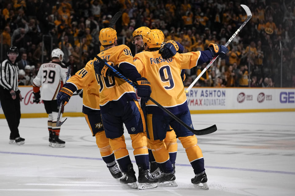 Nashville Predators celebrate a goal by defenseman Roman Josi, second from right, during the second period of an NHL hockey game against the Anaheim Ducks, Tuesday, Nov. 14, 2023, in Nashville, Tenn. (AP Photo/George Walker IV)
