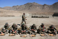 New recruits to the Afghan army Special Forces have their lunch after take part in a military demonstration in Rishkhur district outside Kabul, Afghanistan February 25, 2017. Picture taken on February 25, 2017. REUTERS/Omar Sobhani