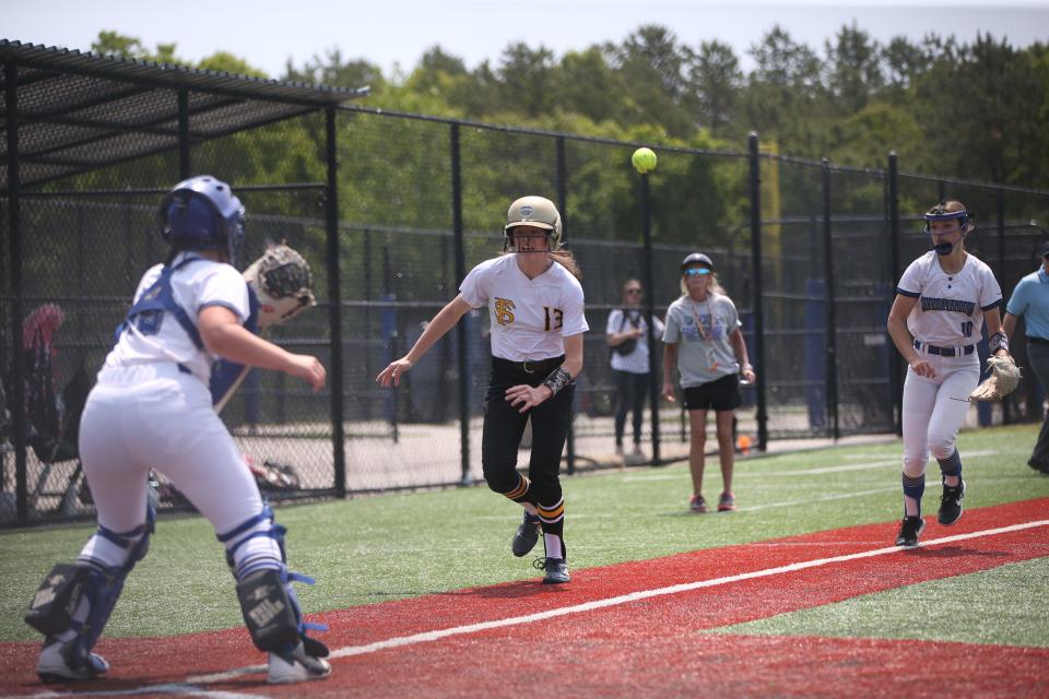 Deposit-Hancock's, from left, Haley Begeal and Kaitlyn Macumber run down Friendship-Scio's Nevaeh Ross during the Class D New York State Softball Championship on June 10, 2023.