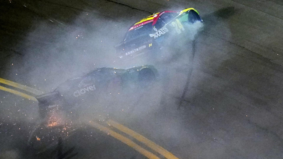 William Byron (24) and Ross Chastain (42) crash during the second NASCAR Daytona 500 duel qualifying auto race Friday, Feb. 12, 2021, at the Daytona International Speedway in Daytona Beach, Fla. (AP Photo/Chris O'Meara)