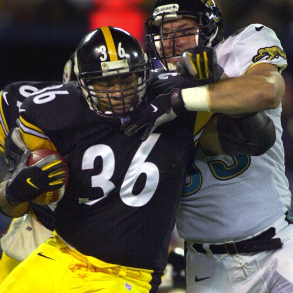 Pittsburgh Steelers running back Jerome Bettis rushes for first quarter yardage against Jacksonville Jaguars' Joel Smeenge Sunday, Nov. 19, 2000 in Pittsburgh.