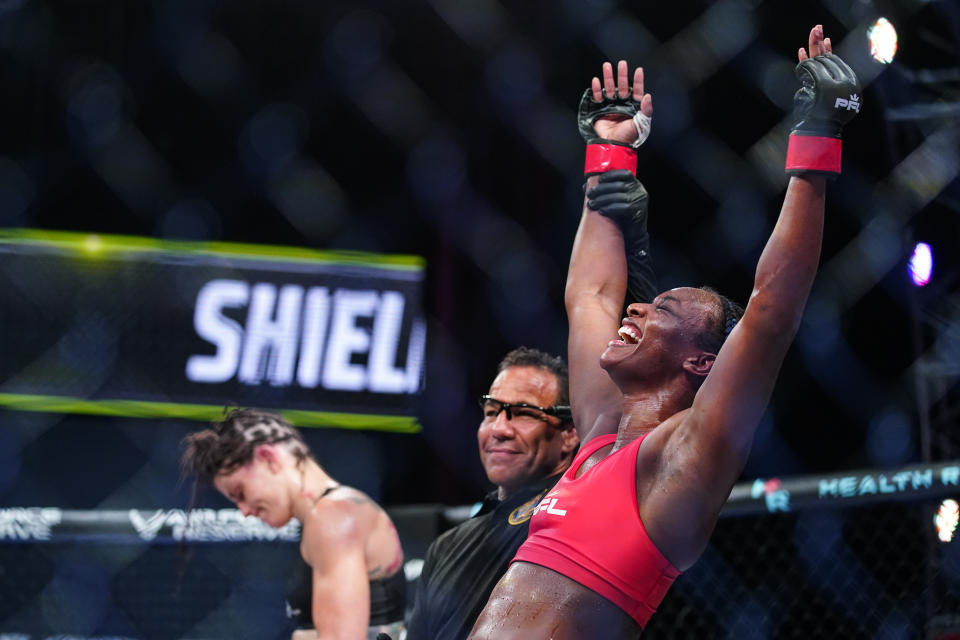 Claressa Shields, right, reacts after winning a Professional Fighters League mixed martial arts bout against Brittney Elkin in Atlantic City, N.J., Friday, June 11, 2021. (AP Photo/Matt Rourke)