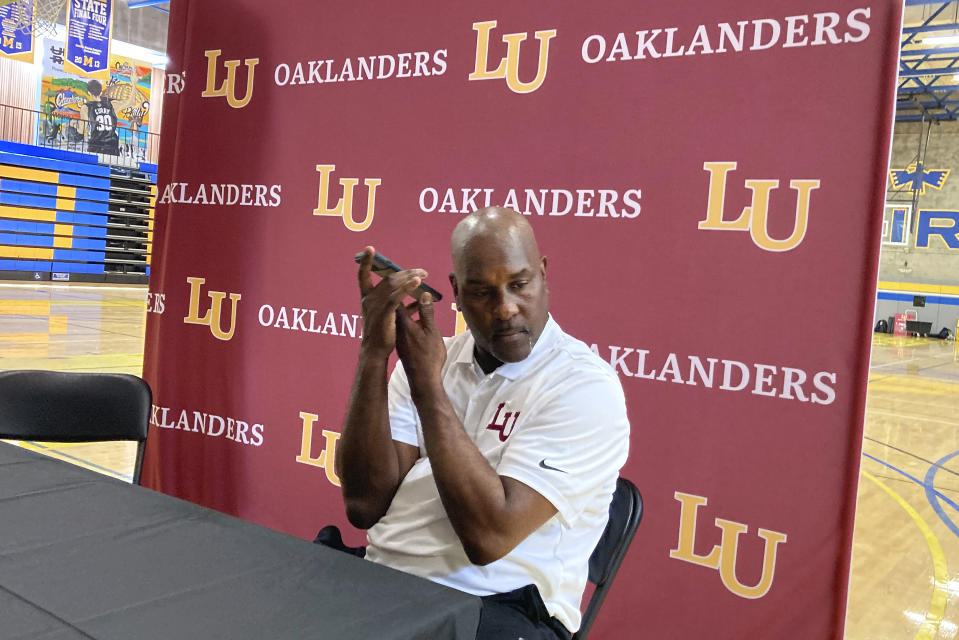Lincoln head coach Gary Payton listens to his phone, Wednesday, Sept. 29, 2021, in Oakland, Calif. Hall of Famer Payton is the new men's basketball coach at Lincoln University, determined to make a lasting mark in his hometown. (AP Photo/Janie McCauley)