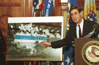 <p>Assistant Attorney General Robert Mueller III points Nov.14,1991 to a photo of the reconstructed wreckage of Pan Am Flight 103, which exploded over Lockerbie Scotland in 1988, killing 270 people. (Photo: Barry Thumma/AP) </p>