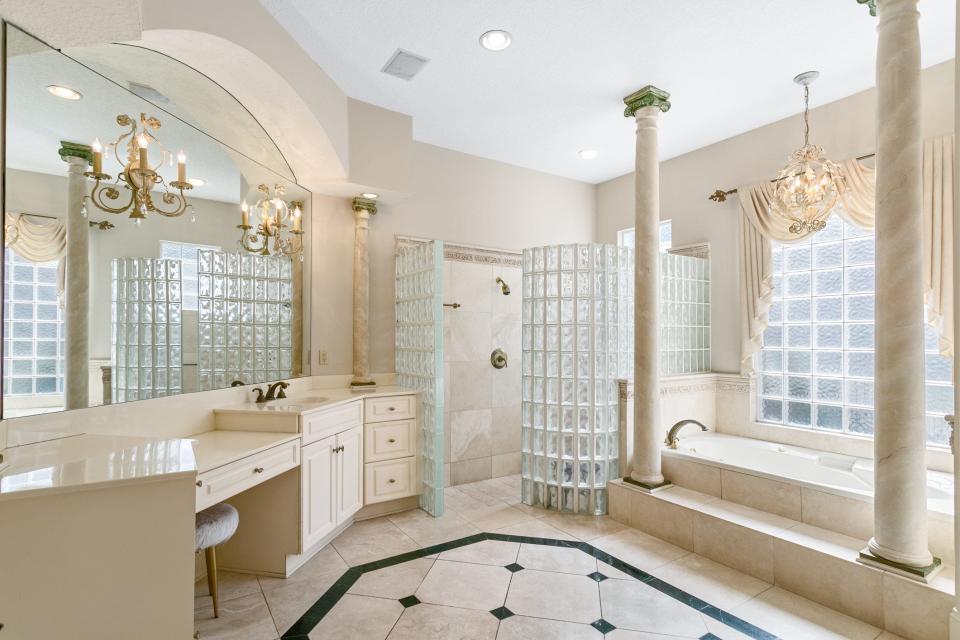 Elegant his-and-hers bathrooms were just one appealing feature in this home at 1336 E. Charter Court when it sold for $1.8 million on Jan. 2. The four-bedroom, 5.5-bath Queen's Harbour home also includes a 50-foot private dock, soaring main staircase and luxurious flooring treatments.