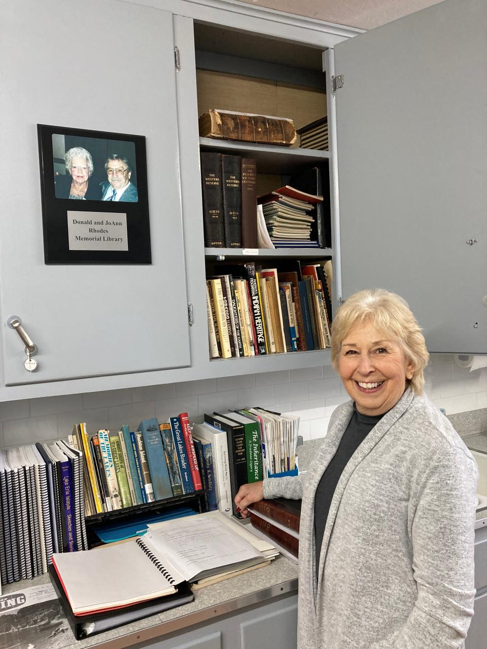 Curator Jane Spriestersbach organizes books at Catawba Museum’s newly named Donald and JoAnn Rhodes Memorial Library