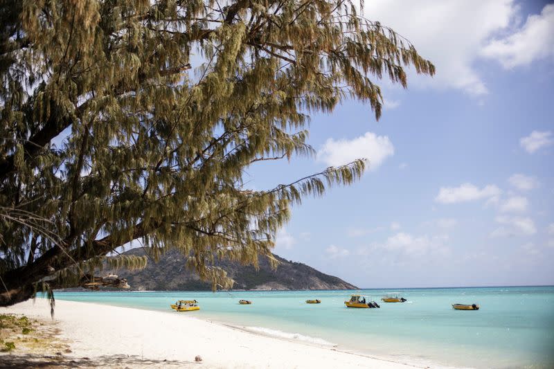 Research vessels sit moored in a bay at a research station on Lizard Island off the coast of Queensland, Australia