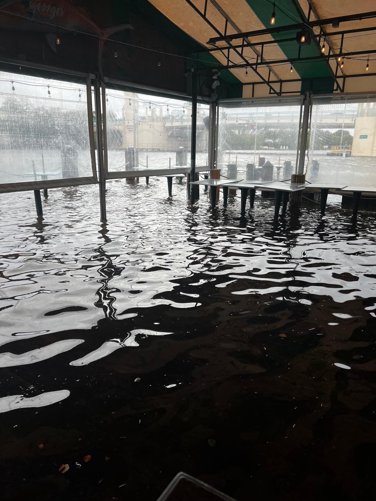 The rising tide from Hurricane Nicole brought water from the Intracoastal Waterway into Two Georges Waterfront Grille in Boynton Beach on Wednesday night.