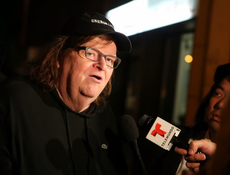 Director Michael Moore speaks to the media at the premiere of his documentary 