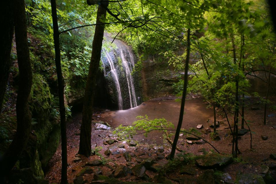 Stephens Falls cascades over a mossy rockface at Governor Dodge State Park in Dodgeville.