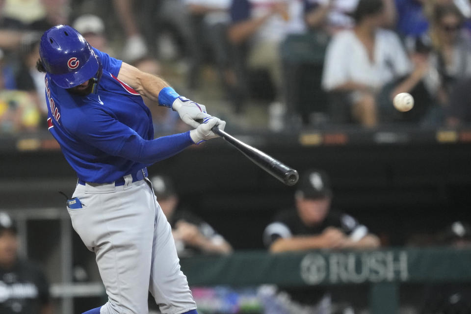 Chicago Cubs' Dansby Swanson hits a home run off Chicago White Sox starting pitcher Michael Kopech, Swanson's second of the night, during the fourth inning of a baseball game Tuesday, July 25, 2023, in Chicago. (AP Photo/Charles Rex Arbogast)