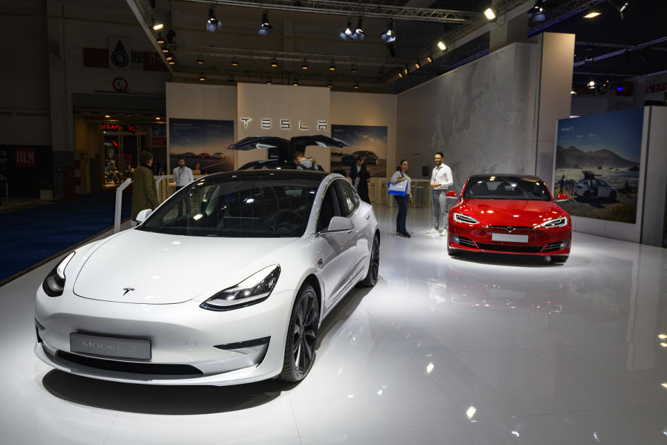 BRUSSELS, BELGIUM - JANUARY 09: Tesla Model 3 compact sedan car in white with a Tesla Model S dual motor all electric sedan in red on display at Brussels Expo on JANUARY 09, 2020 in Brussels, Belgium. (Photo by Sjoerd van der Wal/Getty Images)