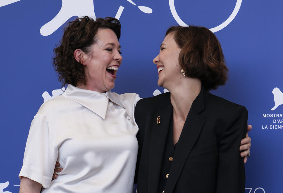 Olivia Colman, left, and Maggie Gyllenhaal pose for photographers at the photo call for the film 'The Lost Daughter' during the 78th edition of the Venice Film Festival in Venice, Italy, Friday, Sep, 3, 2021. (AP Photo/Domenico Stinellis)
