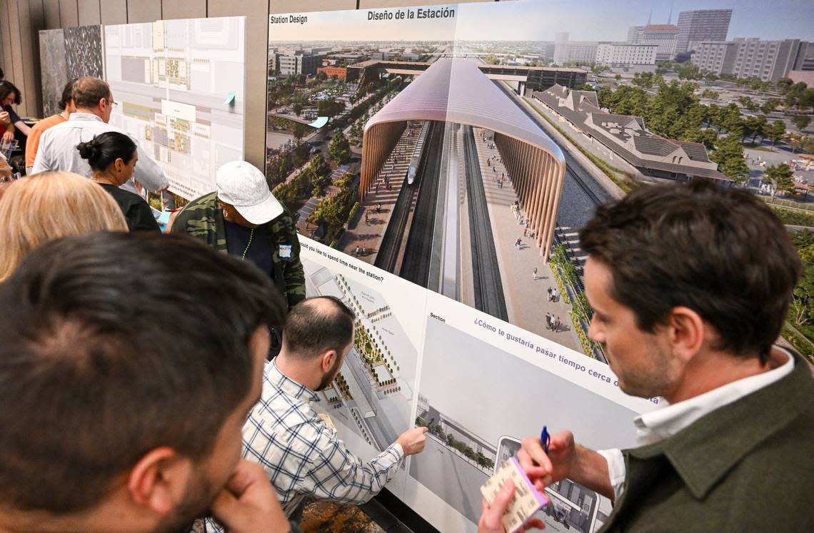 Residents and other interested parties look over plans and renderings that show what’s envisioned for the future Fresno Station of California’s High-Speed Rail project during an informational open house by the High-Speed Rail Authority at the Hilton DoubleTree in downtown Fresno on Wednesday, May 1, 2024.