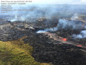 <p>In this Sunday, May 20, 2018, aerial photo provided by the U.S. Geological Survey, lava from the eastern channel of the Fissure 20 complex flows into a crack in the ground in Pahoa, Hawaii. (Photo: U.S. Geological Survey via AP) </p>