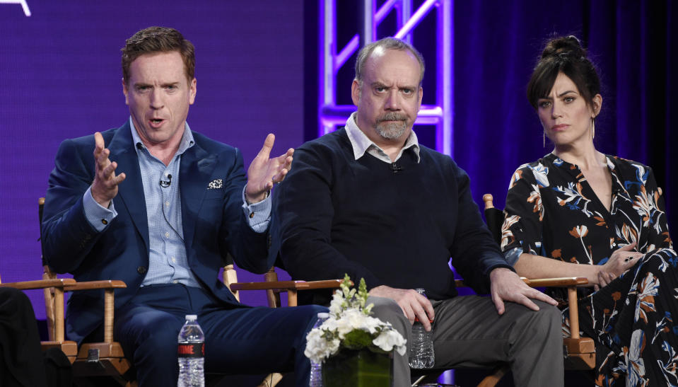 From left, Damian Lewis, Paul Giamatti and Maggie Siff, cast members in the Showtime series "Billions," take part in a panel discussion on the show at the Television Critics Association Winter Press Tour on Saturday, Jan. 6, 2018, in Pasadena, Calif. (Photo by Chris Pizzello/Invision/AP)