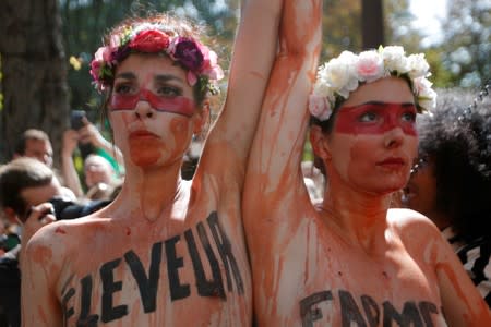 Climate activists attend a protest outside the Brazil's embassy in Paris due the wildfires at Amazon rainforest