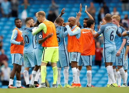 Football Soccer Britain - Manchester City v West Ham United - Premier League - Etihad Stadium - 28/8/16 Manchester City's Joe Hart and Raheem Sterling celebrate with teammates after the match Action Images via Reuters / Carl Recine Livepic