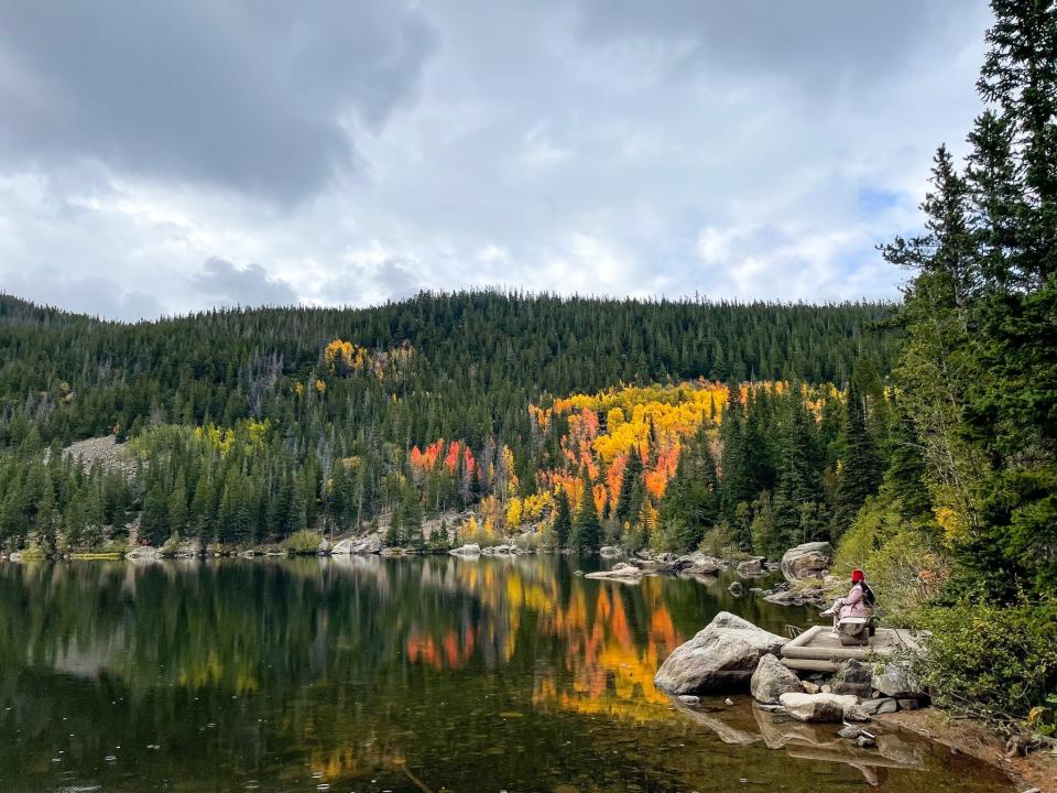 A person sits in silence at Rocky Mountain National Park in Colorado.