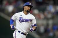 Texas Rangers' Marcus Semien rounds the bases after hitting a solo home run in the third inning of a baseball game against the Cleveland Guardians in Arlington, Texas, Saturday, Sept. 24, 2022. (AP Photo/Tony Gutierrez)