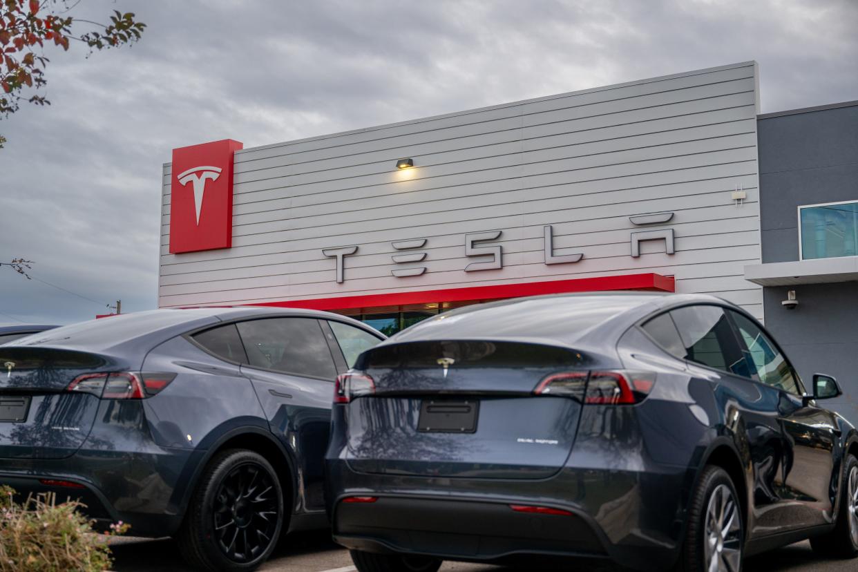 Two Teslas outside dealership