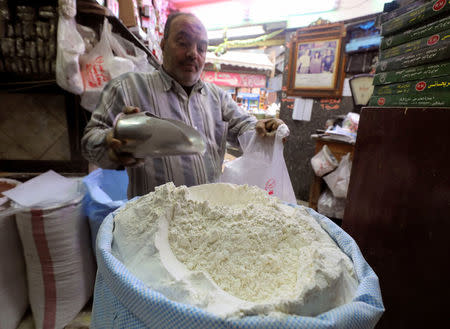 A worker at a herbal store buys flour in Cairo, Egypt January 10, 2017. REUTERS/Mohamed Abd El Ghany