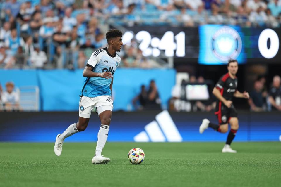 Charlotte FC defender Adilson Malanda (29) dribbles the ball against D.C. United during Saturday’s first half at Bank of America Stadium. Cory Knowlton-USA TODAY Sports