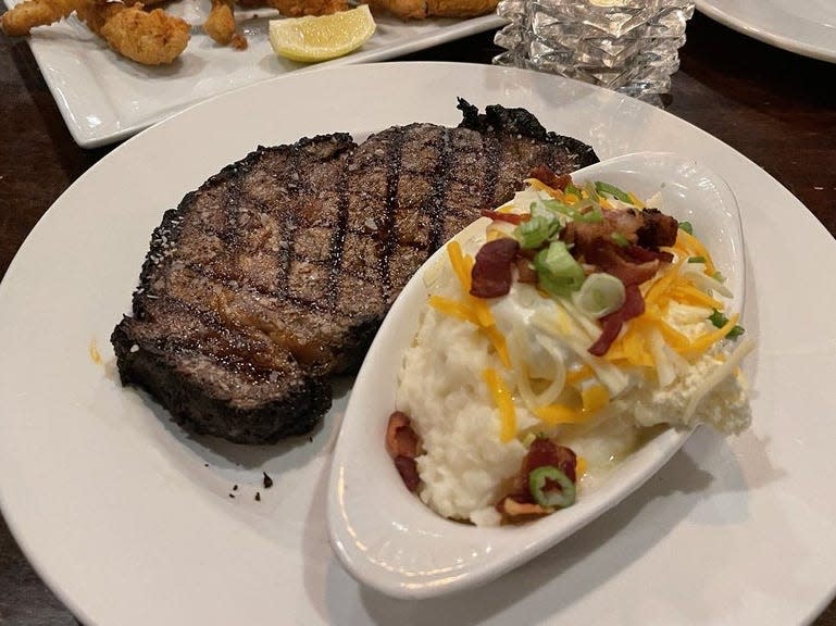 Steak and loaded mashed potatoes at Lost Creek Grill.