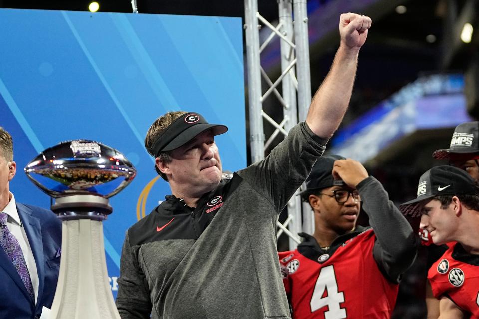 Dec 31, 2022; Atlanta, Georgia, USA; Georgia Bulldogs head coach Kirby Smart gives a fist pump following the Peach Bowl against the Ohio State Buckeyes in the College Football Playoff semifinal at Mercedes-Benz Stadium. Georgia beat Ohio State 42-41. Mandatory Credit: Adam Cairns-The Columbus Dispatch

Ncaa Football Peach Bowl Ohio State At Georgia