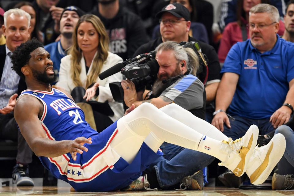 Philadelphia 76ers center Joel Embiid reacts to a call during the first half of an NBA basketball game against the Cleveland Cavaliers, Wednesday, Nov. 30, 2022, in Cleveland. (AP Photo/Nick Cammett)
